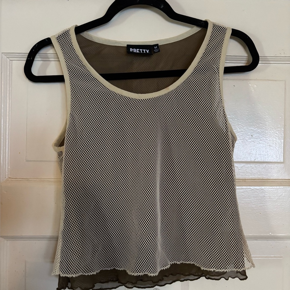 Small mesh like cream under grey tank
Fits well good fabric
